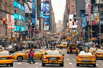 Noisy daytime traffic on a New York City street.