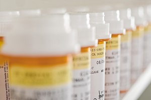 Prescription pill bottles lined up in rows