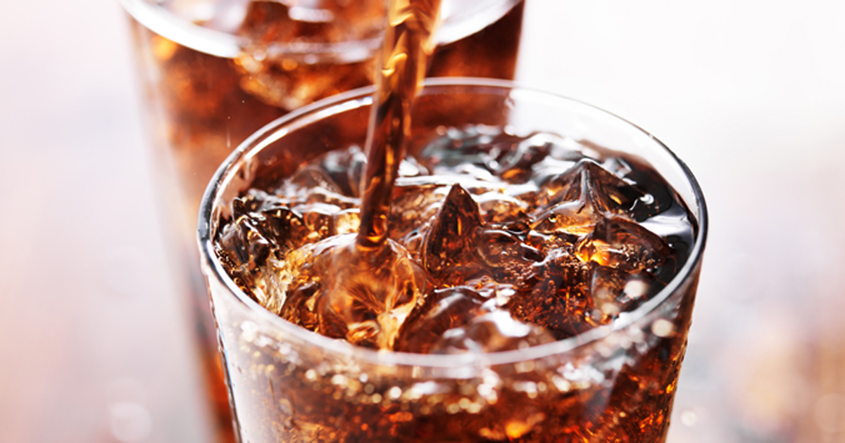 Soft Drink Being Poured Into Glass